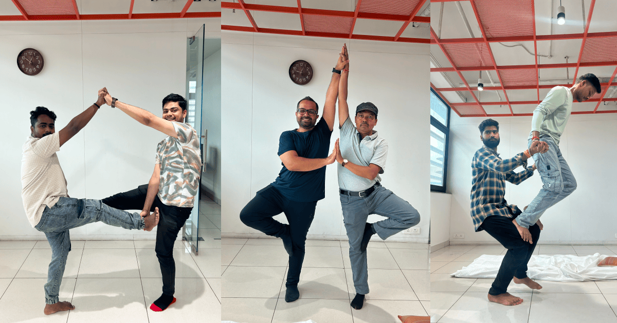 Employees practicing mindfulness and stretching exercises in the office space