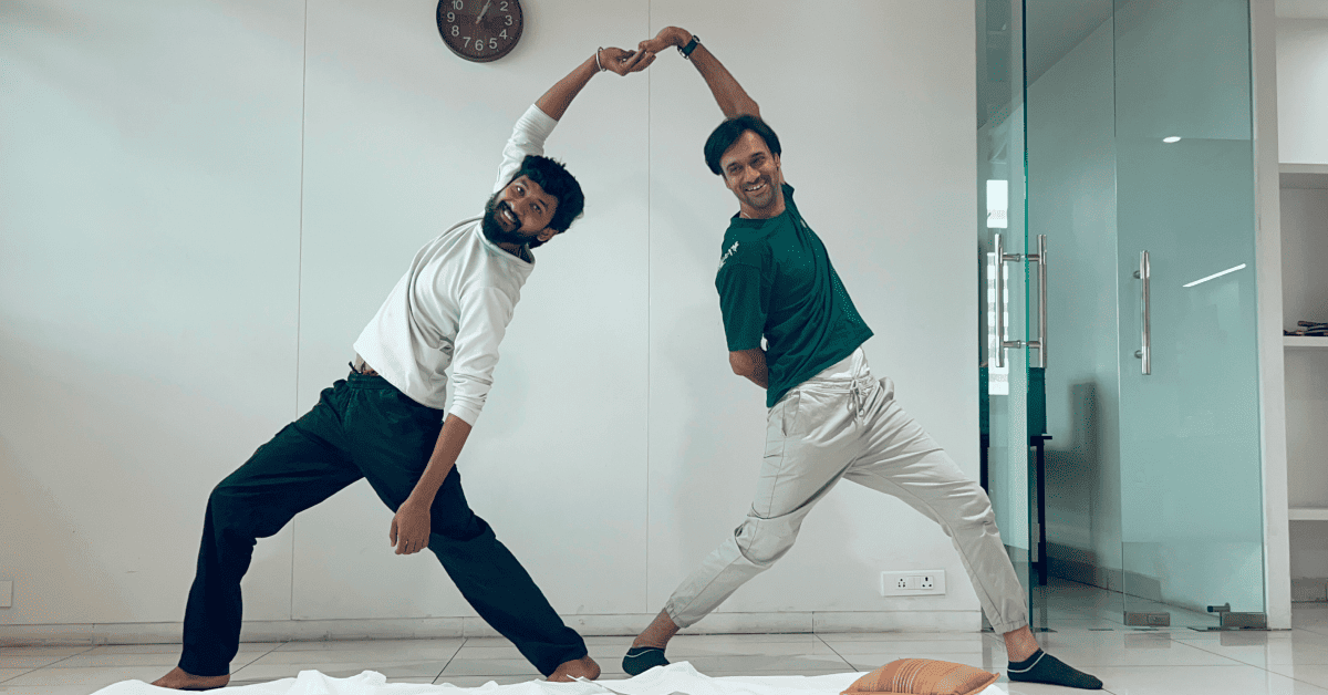 Team members laughing and bonding during an informal yoga celebration at work